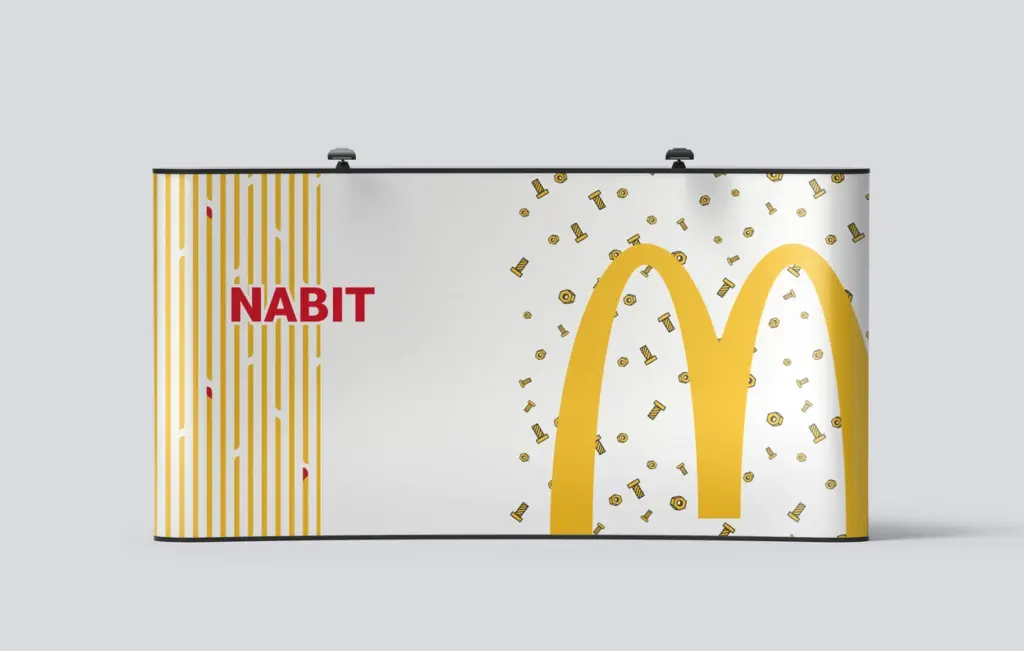 Mockup for a banner wall for McDonald's, it features the McDonald's logo, French fries and nuts and bolts in a decorative pattern